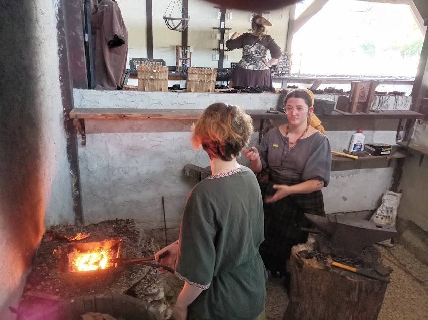 Riley teaching the forge to Megan